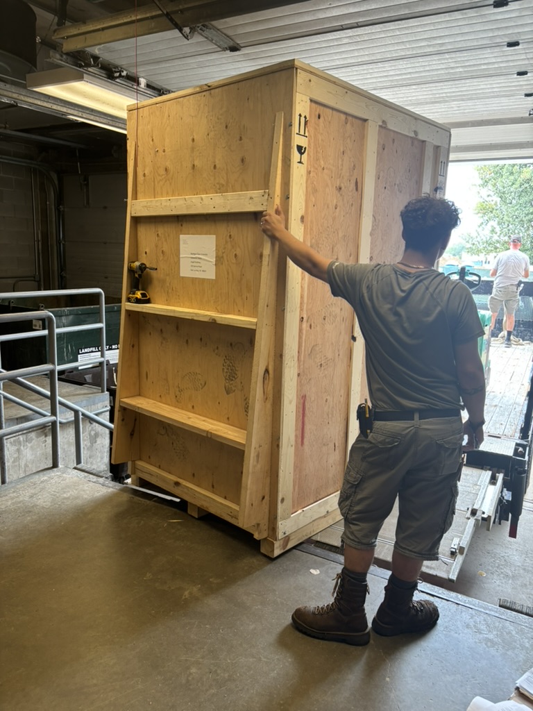 Shipping crate being opened at the loading dock